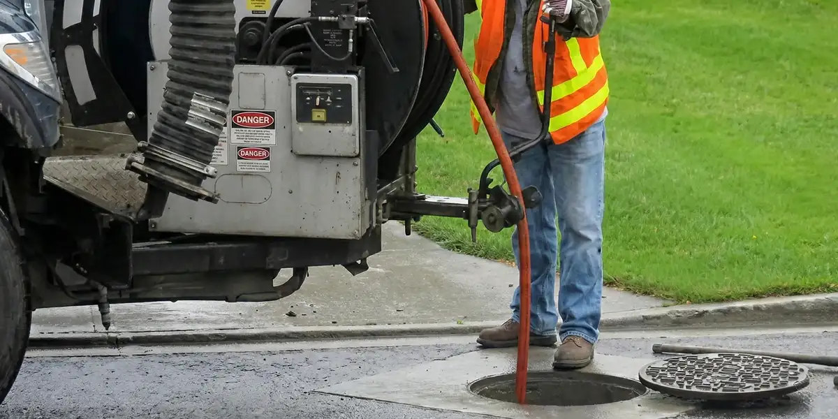 sewage clean up professionals using industrial equipment to remove contaminated wastewater in Los Angeles, CA