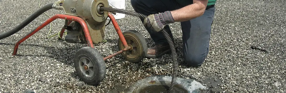sewer rodding technician actively removing blockages from a sewer line in Los Angeles, CA